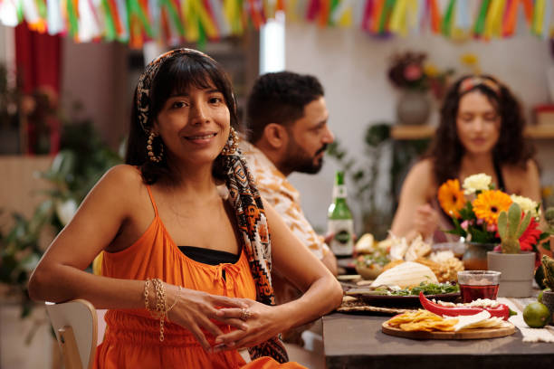istock Young woman sitting by served table 2148435300