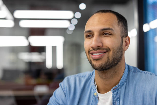 istock Confident Hispanic businessman in modern office setting 2148436279