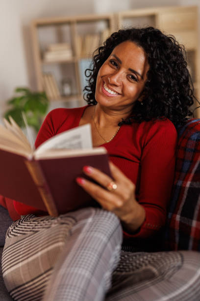 istock Simply relaxing on the sofa and reading a good book during Christmas 2148439973