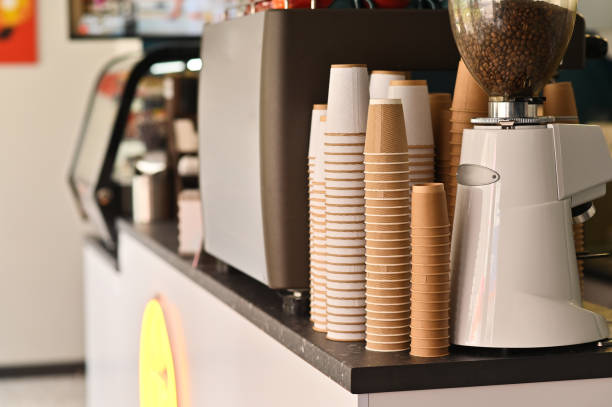 istock coffee grinder and coffee cups in the coffee shop 2148440577