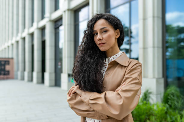 istock Confident professional woman standing outside office building 2148441370