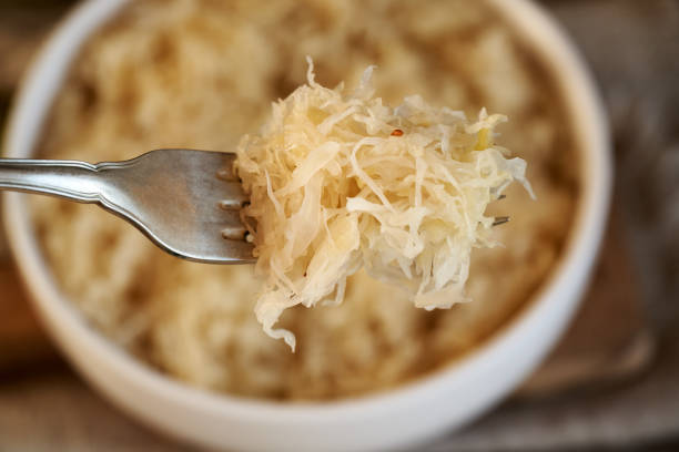 istock Closeup of fermented cabbage or sauerkraut on a fork 2148441499