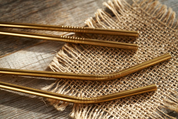 istock Ecological stainless steel straws on a table 2148441584