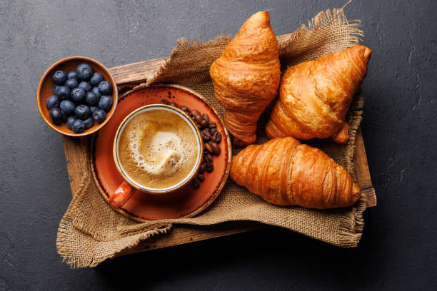 istock Cappuccino coffee and fresh croissants 2148442123