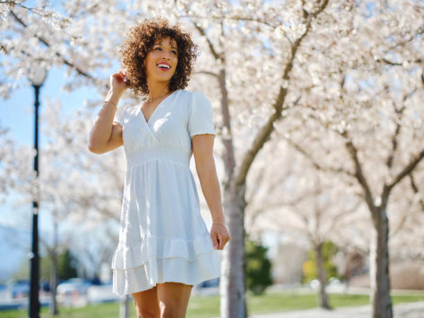 istock Woman in Springtime Among Cherry Blossoms 2148442613