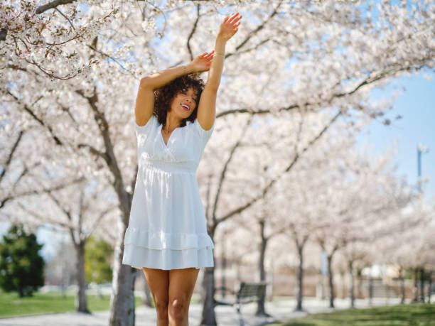 istock Woman in Springtime Among Cherry Blossoms 2148442672