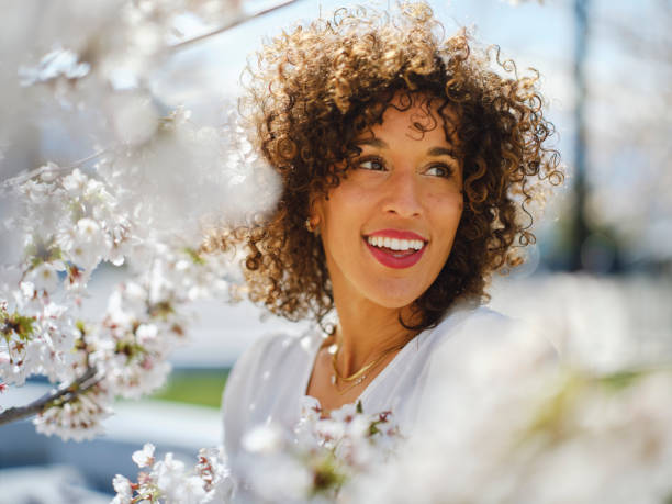 istock Woman in Springtime Among Cherry Blossoms 2148442711