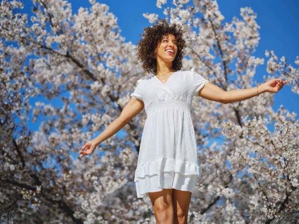 istock Woman in Springtime Among Cherry Blossoms 2148442820