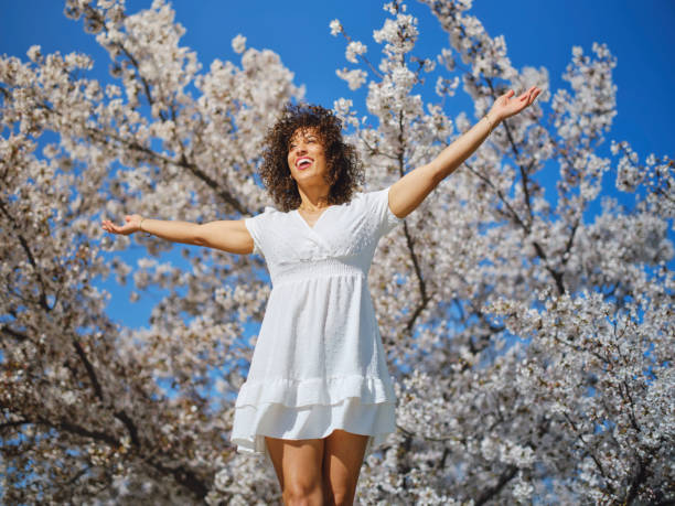 istock Woman in Springtime Among Cherry Blossoms 2148442830