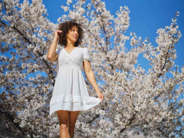 istock Woman in Springtime Among Cherry Blossoms 2148442841