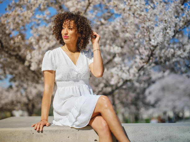 istock Woman in Springtime Among Cherry Blossoms 2148442872