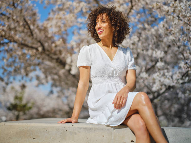 istock Woman in Springtime Among Cherry Blossoms 2148442888