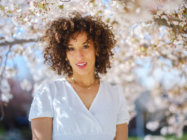 istock Woman in Springtime Among Cherry Blossoms 2148442981