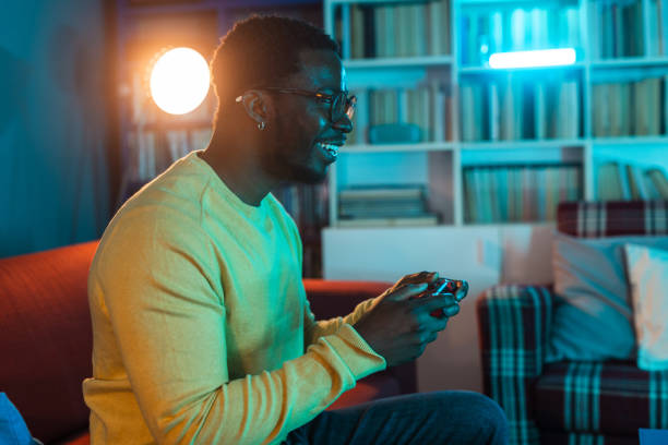 istock Young man focusing on a video game 2148443054