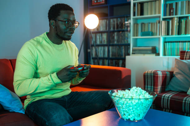 istock Young man having a game night at home 2148443059