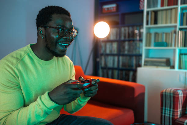 istock Young man focusing on a video game 2148443066