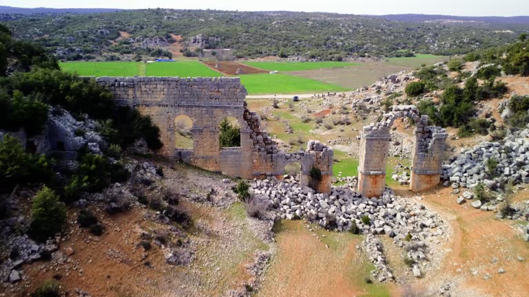 Aerial view of Olba shows ancient Roman city ruin, Turkey. Drone footage captures ruin, main gate and historical landscape. Explore depth of ruin from above