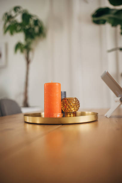 Tasteful display of candles on a gold tray, enhancing the home ambiance