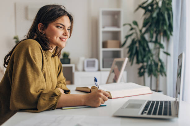 istock Young woman working from home 2148446007