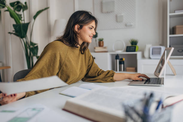 istock Young woman working from home office 2148446131