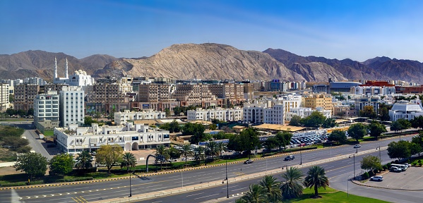 Muscat, Oman, March 15, 2024: Panoramic view of the Omani capital Muscat on a sunny day. On the left is the Al Rahma Mosque.