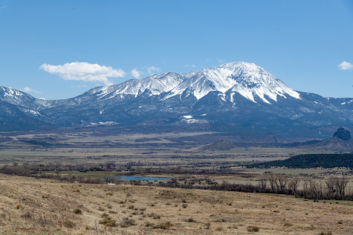 View of Spanish Peaks in southwestern Huerfano county of Colorado in western USA of North America. Elevation is about 13631 feet high. formed by ancient volcanic activity and erosion. Nearby towns are Pueblo, Denver, Colorado Springs, Trinidad, and Walsenburg, Colorado. Photo from Lathrop State Park.