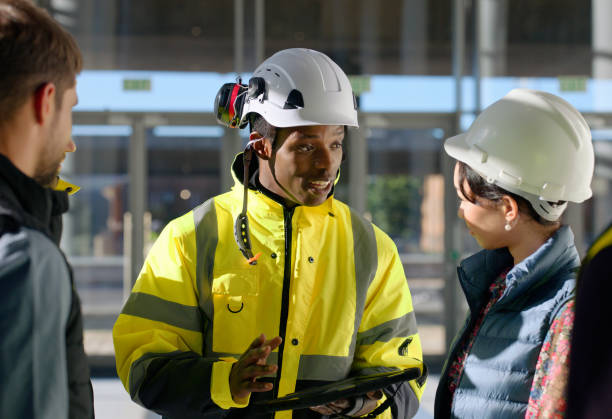 istock Engineering, team and meeting or tablet with discussion for construction, building project review and development feedback. Collaboration, contractor and diversity with technology for communication 2148448779