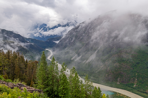 Salmon River in the mist with meltwater of Salmon Glacier near Stewart, British Columbia, Canada.