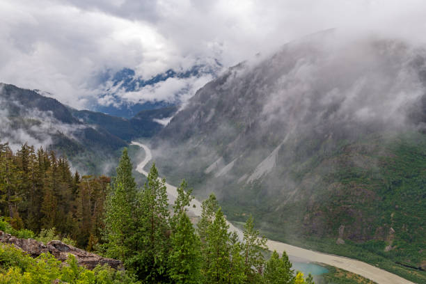 Salmon River, Stewart, Canada Salmon River in the mist with meltwater of Salmon Glacier near Stewart, British Columbia, Canada. salmon glacier stock pictures, royalty-free photos & images