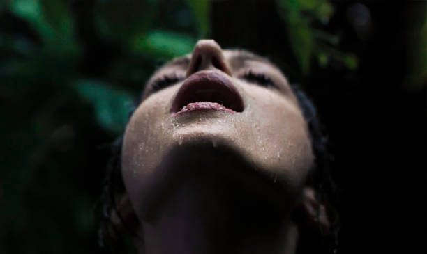 istock Woman enjoying summer rain 2148450302