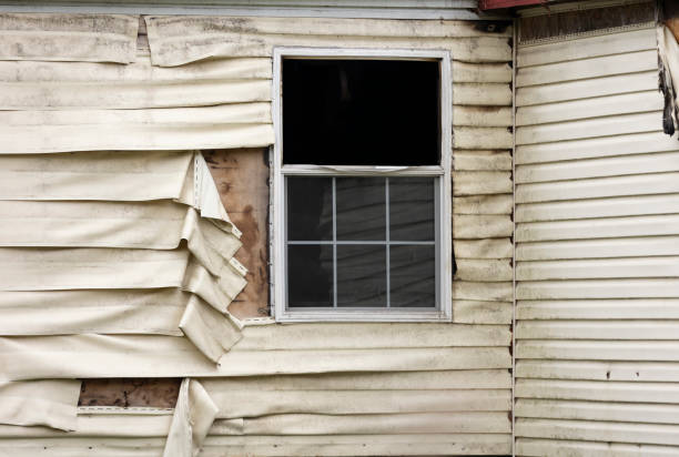 istock Fire Damaged Vinyl Siding And Window On A Home Exterior 2148450517