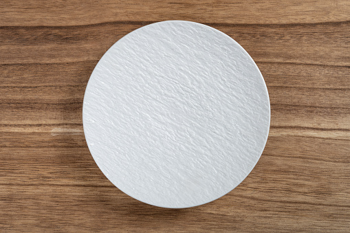 top view white stone-patterned ceramic plate at horizontal composition