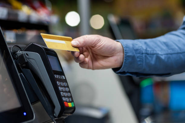 istock Person using credit card at a contactless payment terminal 2148451693
