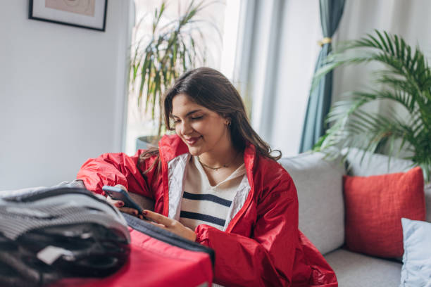 istock Young female delivery rider preparing for work at home 2148451728