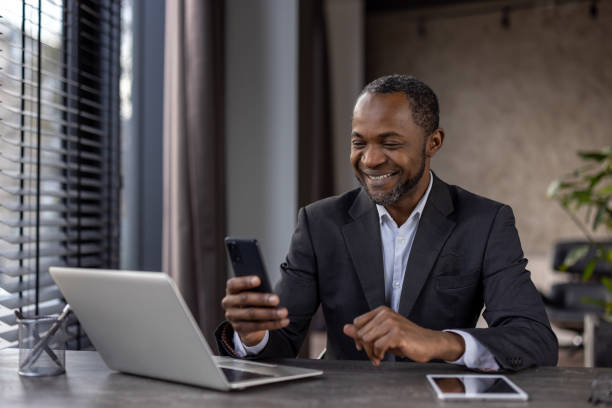 istock Successful businessman enjoying a break with digital devices in modern office 2148451806