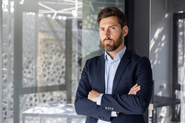 istock Confident businessman standing in a modern office 2148452760