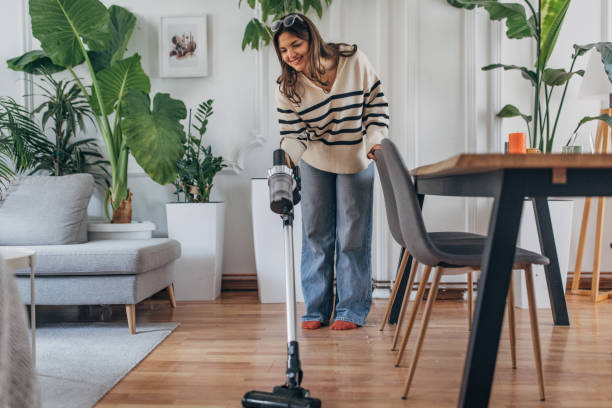 istock Young woman enjoying house cleaning 2148452833