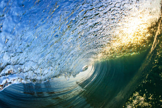 istock Inside view of a beautiful curling wave on sunrise 2148453066
