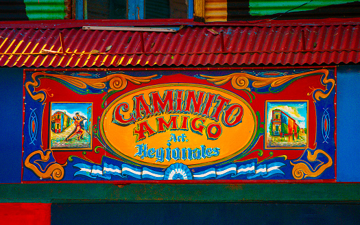 Caminito Street in Buenos Aires, Argentina. March 24, 2009. \nColorful advertisements and garish typography adorn this characteristically colorful and lively street, strengthening its unique personality in the world.