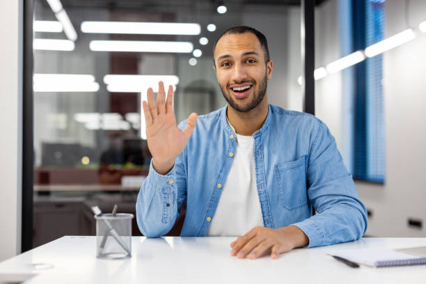 istock Indian man in office having a video call and smiling 2148455226