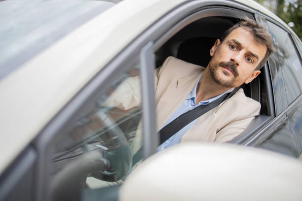 istock Young businessman in a car 2148455475