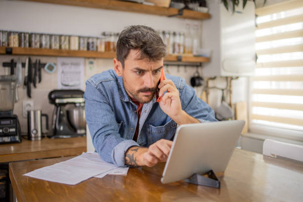 istock Young man with a smartphone at home 2148455614