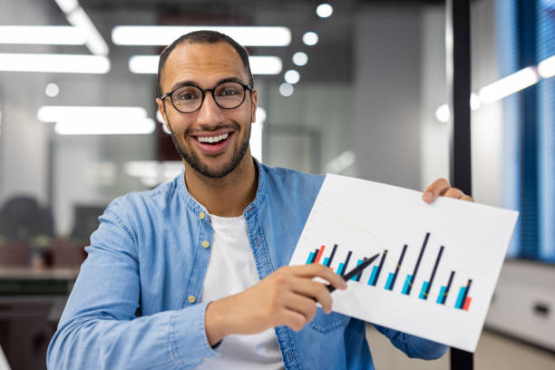 istock Indian businessman presenting growth chart in office 2148456119