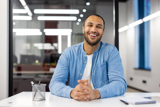 istock Smiling Indian man at office looking at camera 2148456591