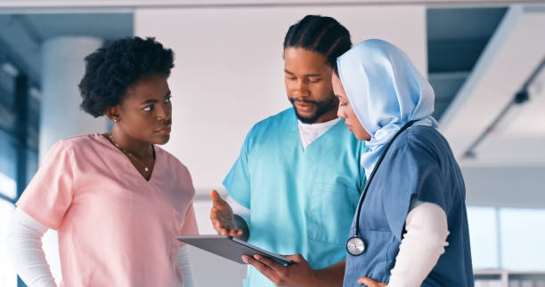 istock Nurses, teamwork and planning on tablet in medical research, solution and advice on patient charts. Healthcare group or students in diversity with digital technology for report on accessible medicine 2148457531