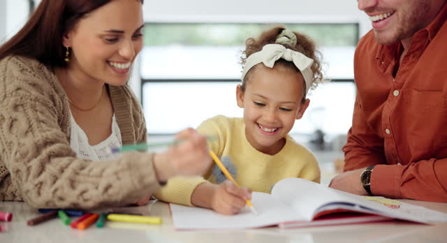Girl, child and parents or writing with learning on kitchen counter for education, homework and knowledge. Family, mother or father with kid for homeschooling, support or happy for studying by table