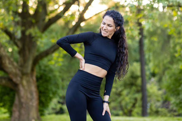 istock Hispanic woman experiencing back pain during outdoor workout 2148460976