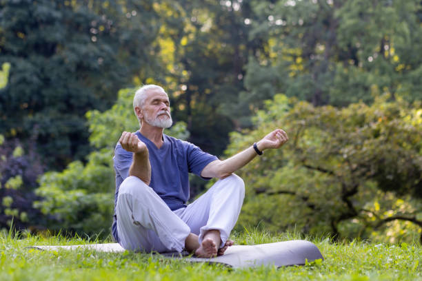 istock Senior man in serene park setting practicing mindful meditation on a sunny day 2148461341