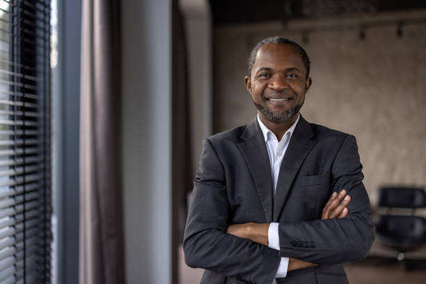 istock Confident businessman smiling in office environment 2148463257