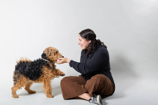 istock Young Woman With Her Dog 2148463981